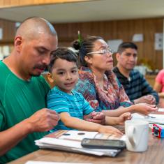 Dad and son in learning environment