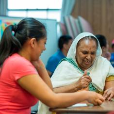 Two women doing skills training together at a table