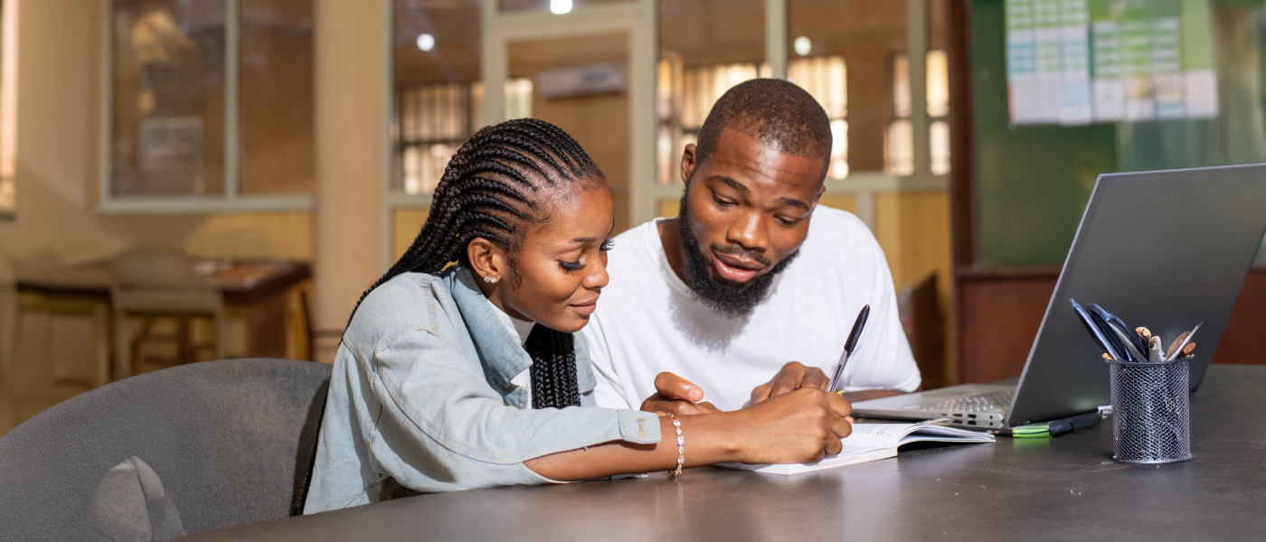 Two adult students study together.