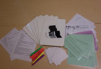 an prepared kit with laminated cards, dry erase boards and markers