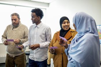 four learners do a speaking activity together